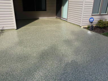 An example of exposed aggregate concrete applied to a driveway in Wollongong.