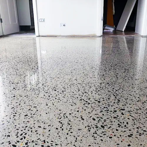 Close up of polished concrete looking glossy after finished job on a driveway in Wollongong.